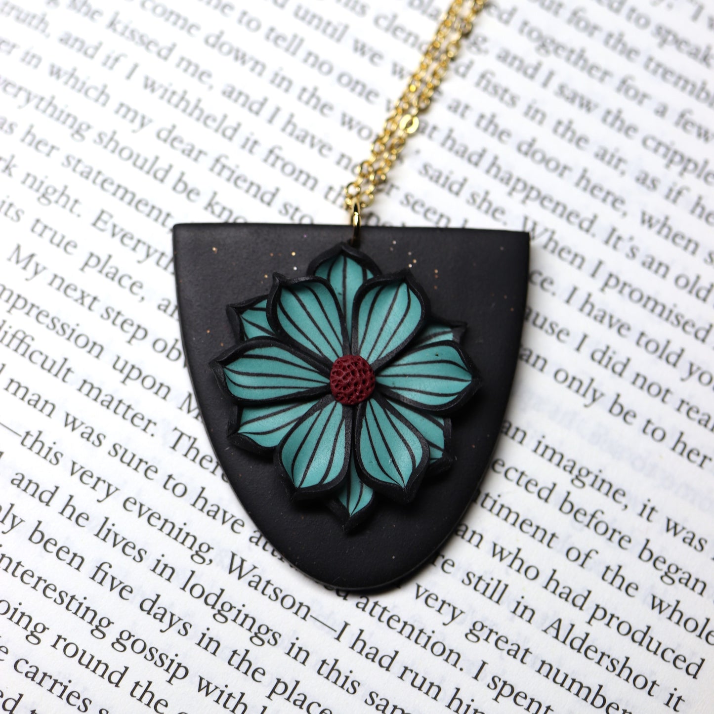 Dark Pendant with Lake Blue Flower